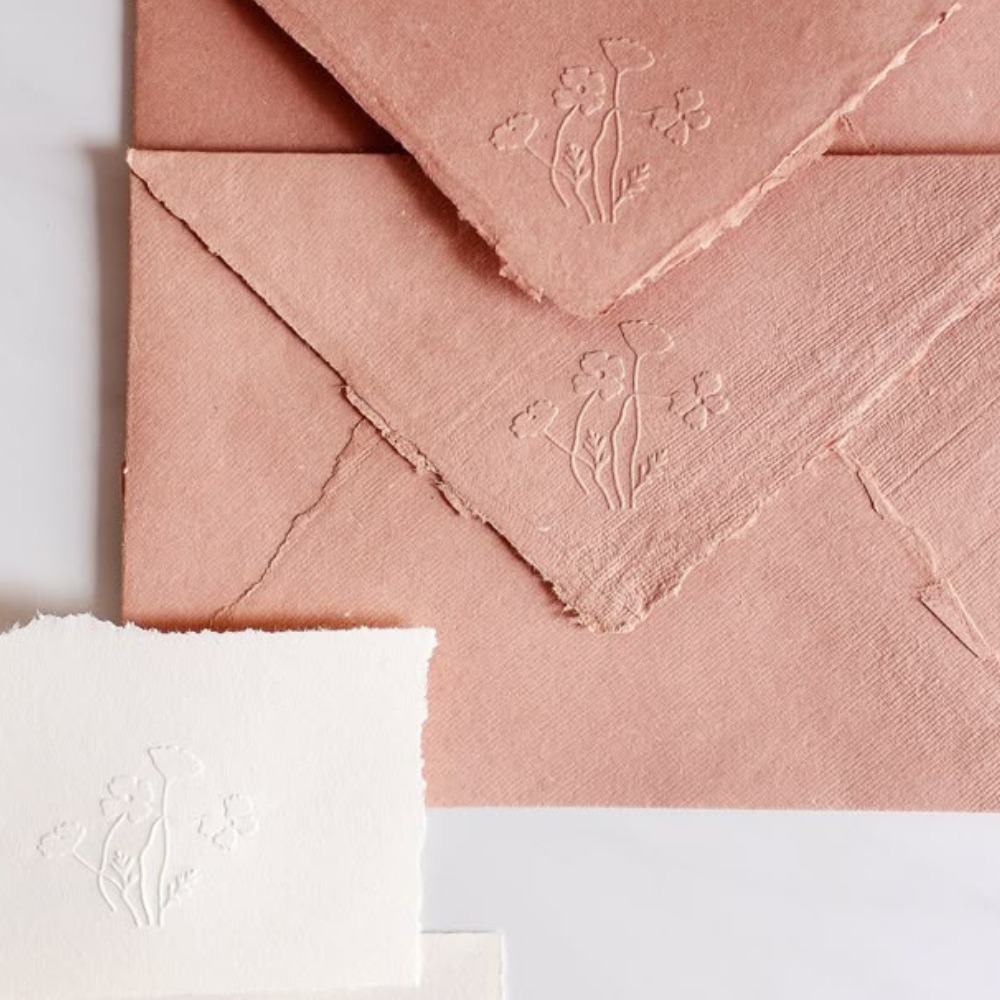 Enveloped and paper scraps with embossed examples