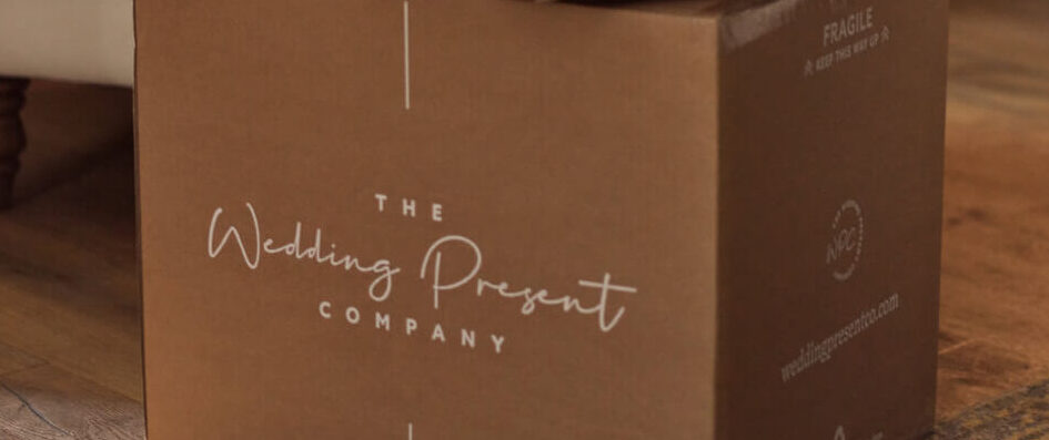 Cardboard box with "the wedding present company" written on it