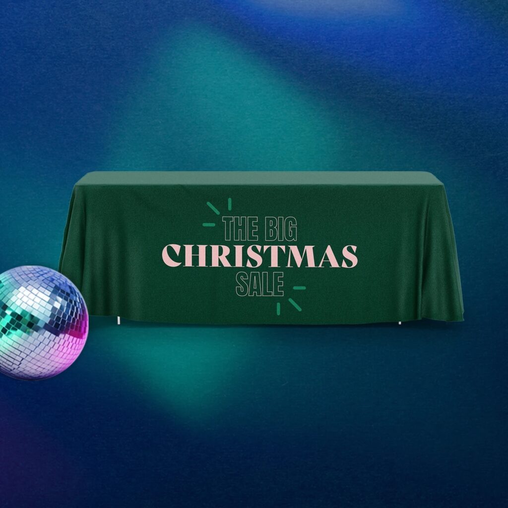 Custom Tablecloth covering a Christmas Market display. It says "The Big Christmas Sale". 