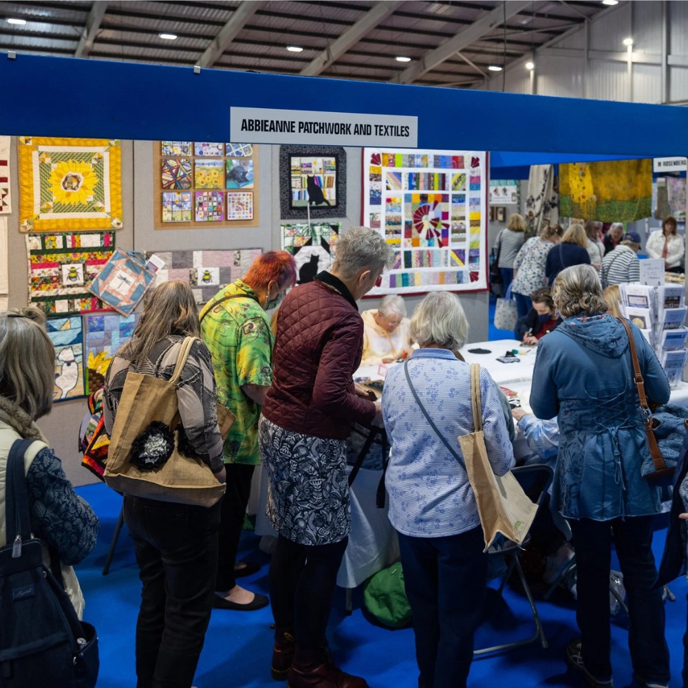 Visitors peruse a stall at Craft 4 Crafters event.