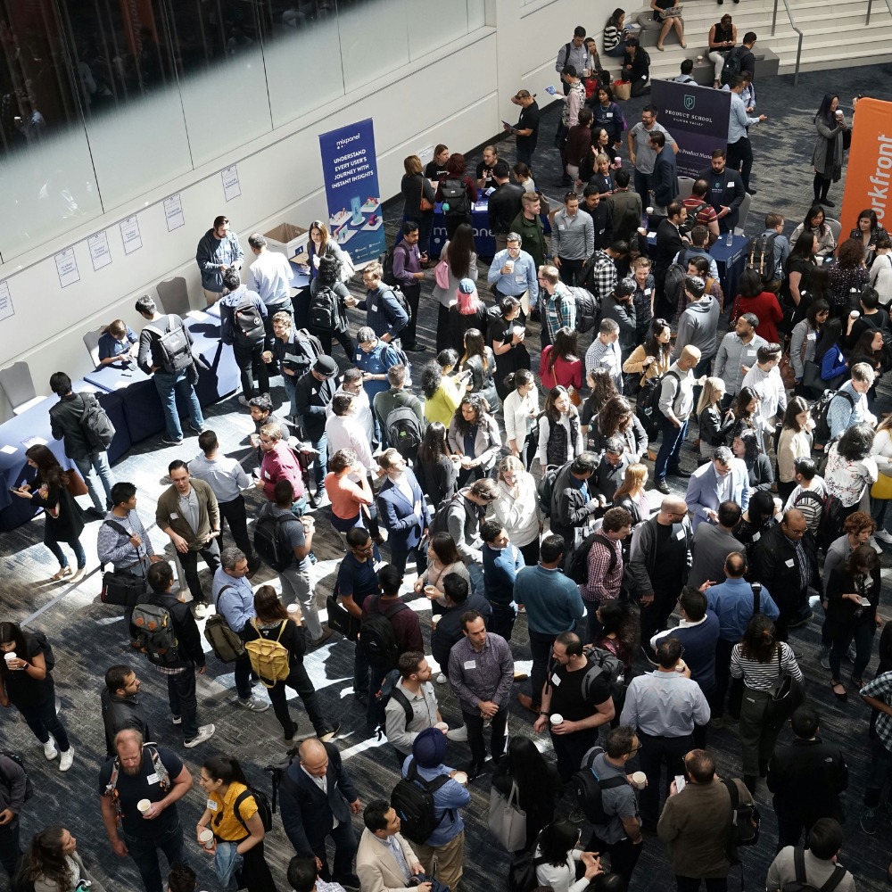 A busy design trade show photographed from a high angle.