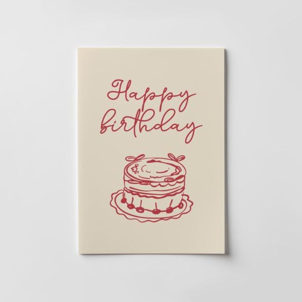 Cream card with a simple red line drawing of a cake and handwritten text reading “Happy birthday.”