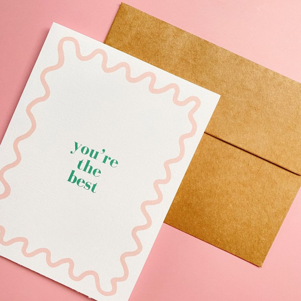 White card with pink wavy border and green text reading “you’re the best,” shown with a kraft envelope