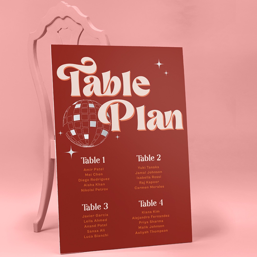 A large burgundy Wedding Sign displaying a table plan. 