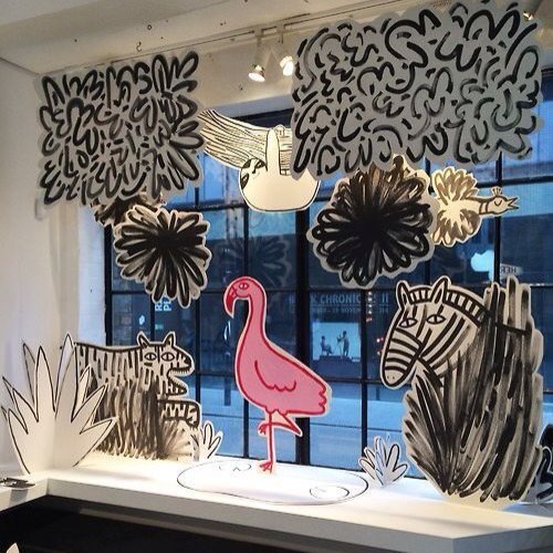 A window display featuring display boards of wild animals and nature.