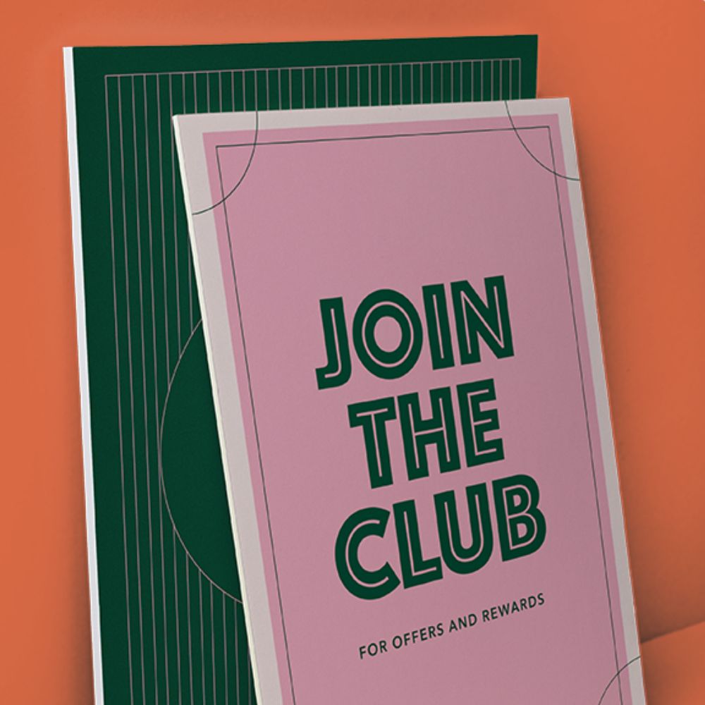 Display Board that reads "Join the Club for Offers and Rewards" in green text on a pink background. 