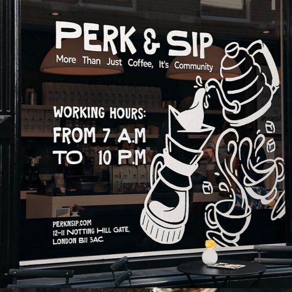 Perk & Sip coffee shop window with white vinyl stickers.