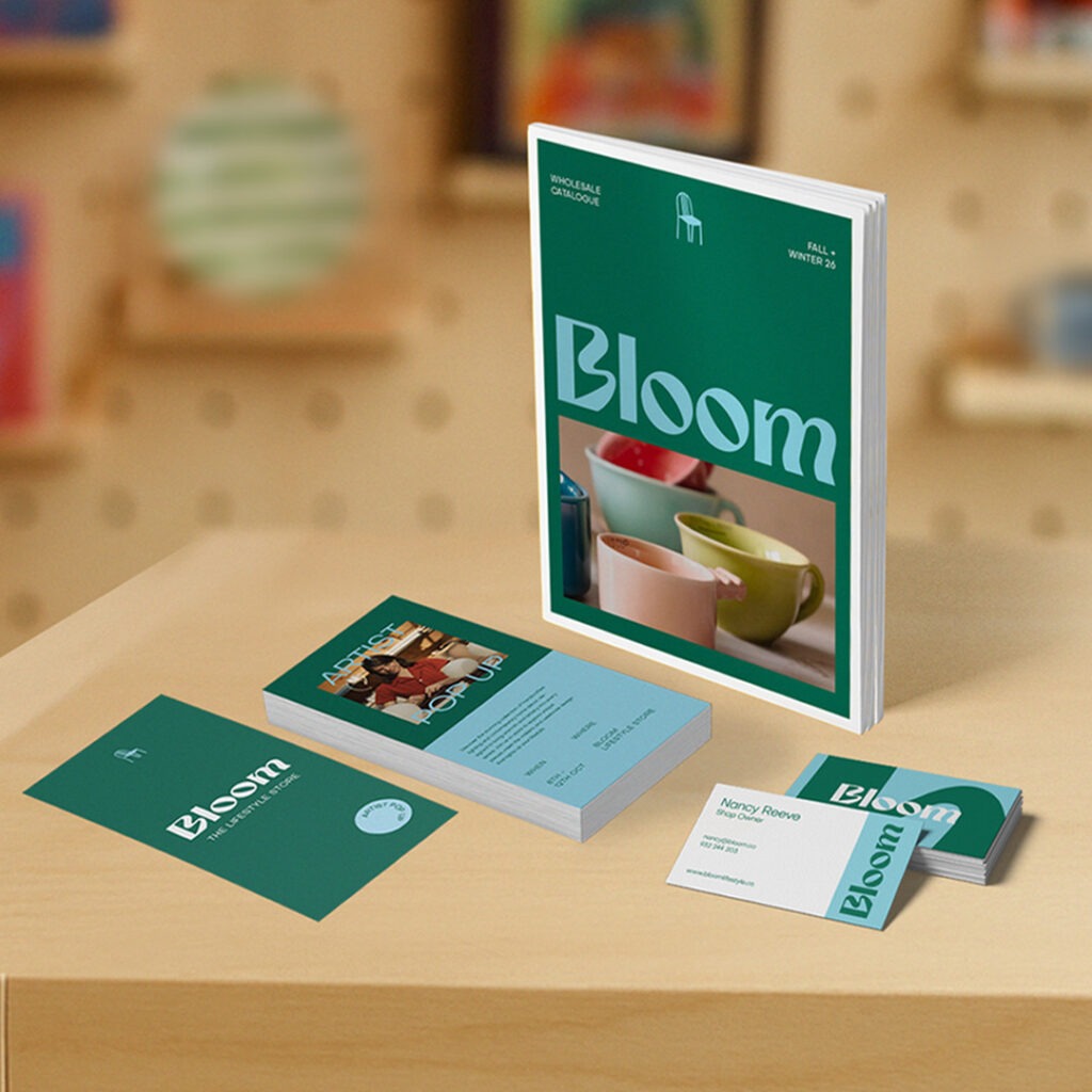 An assortment of Leaflets, Brochures and Business Cards with the brand name "Bloom". They are green and blue themed.