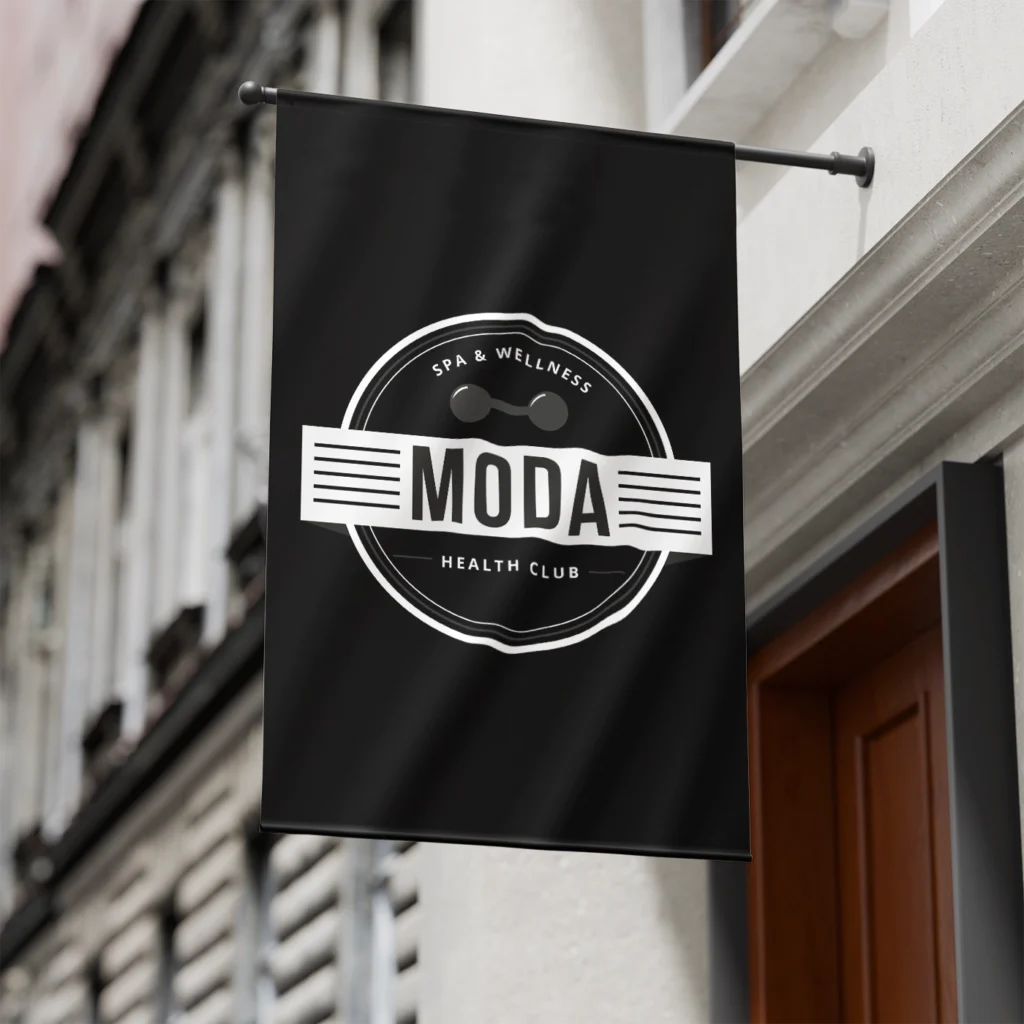 Black and white flag on a pole attached to a wall.