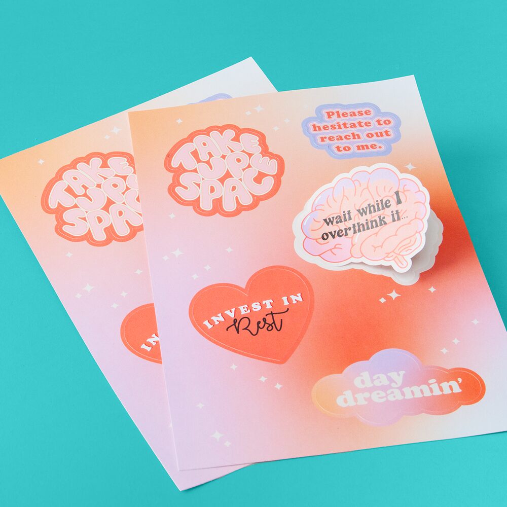 Custom Sticker Sheets featuring different designs in sunset shades of red, yellow and pink.