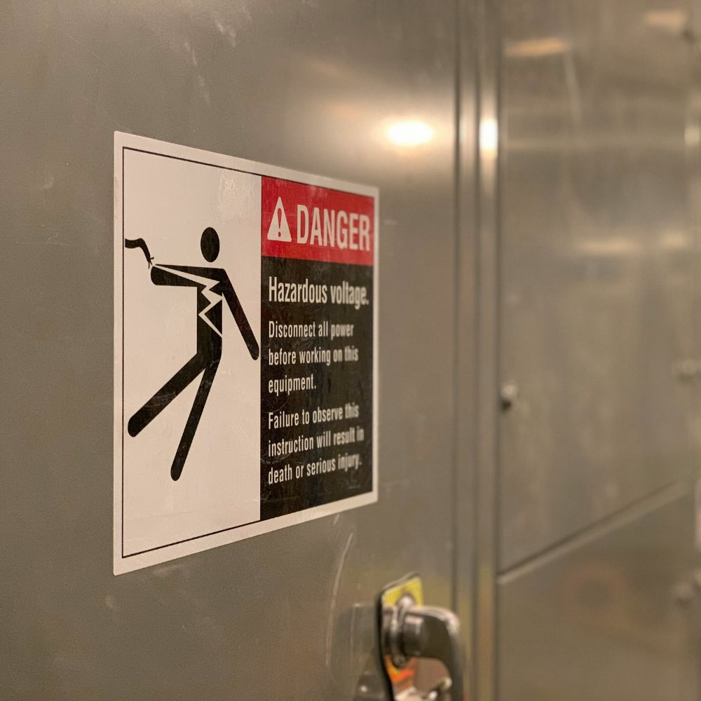 A health and safety Sign warning of hazardous voltage.
