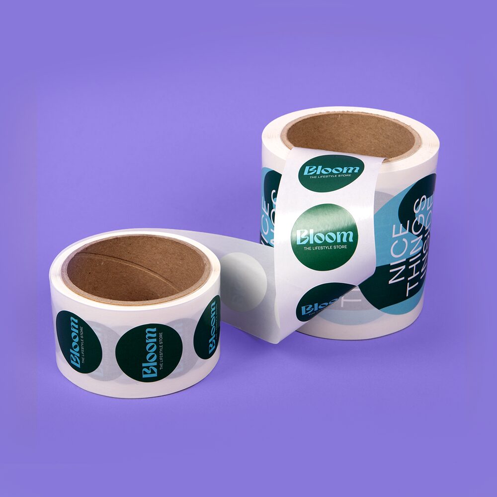 Dark green Stickers on a Roll on a purple background.