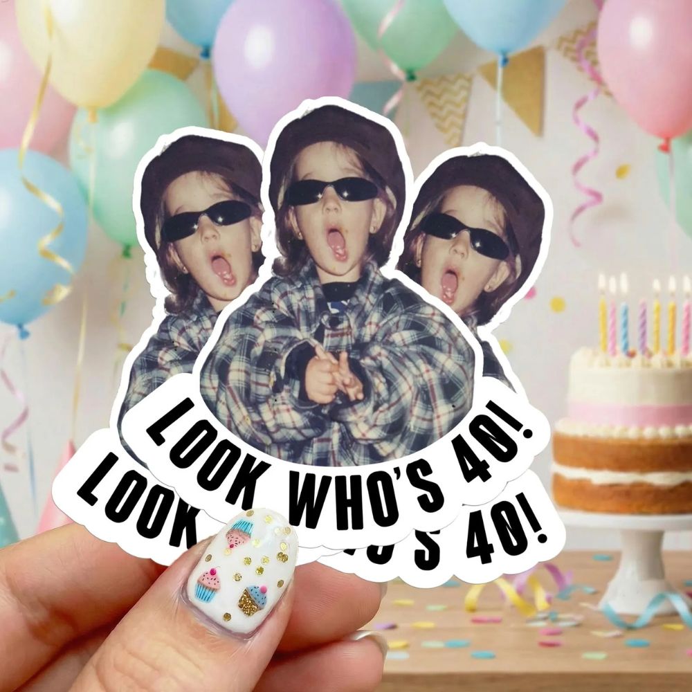 A custom photo Sticker with a baby picture, captioned 'look who's 40!'
