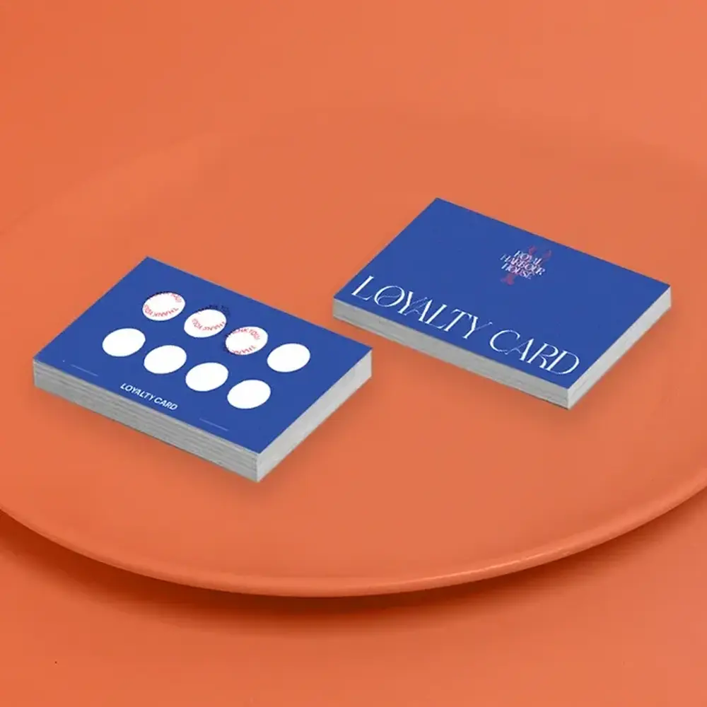 Blue Loyalty Cards on a rusty orange background.