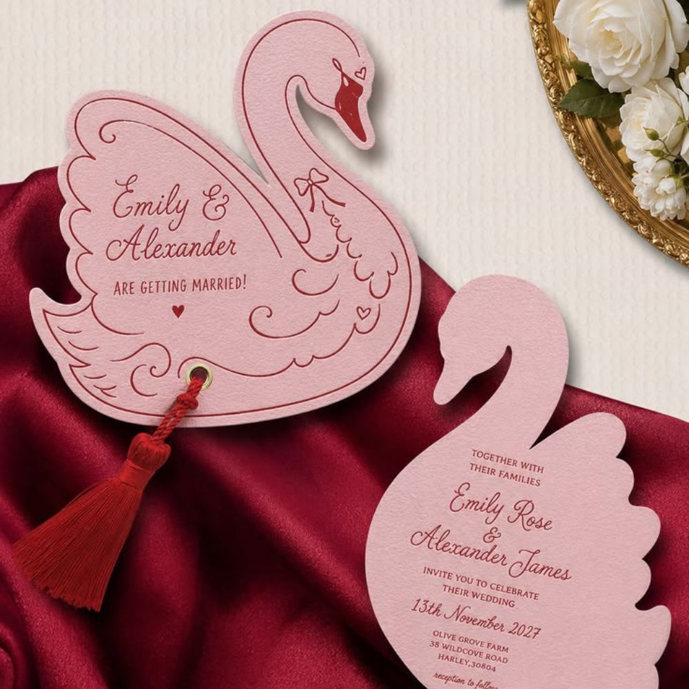 Two Bespoke swan shaped Wedding Invitations.