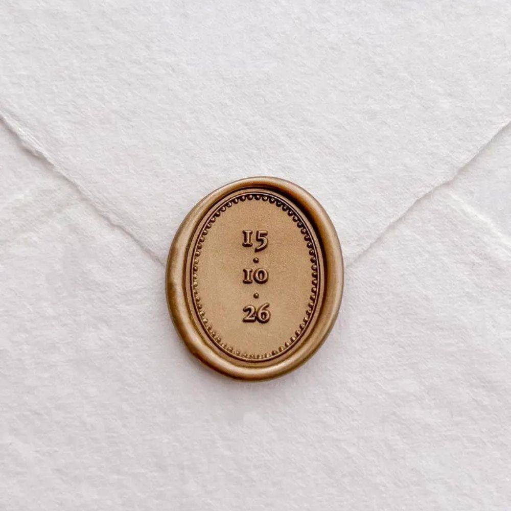 A wax seal featuring the date of the wedding - 15.10.26.