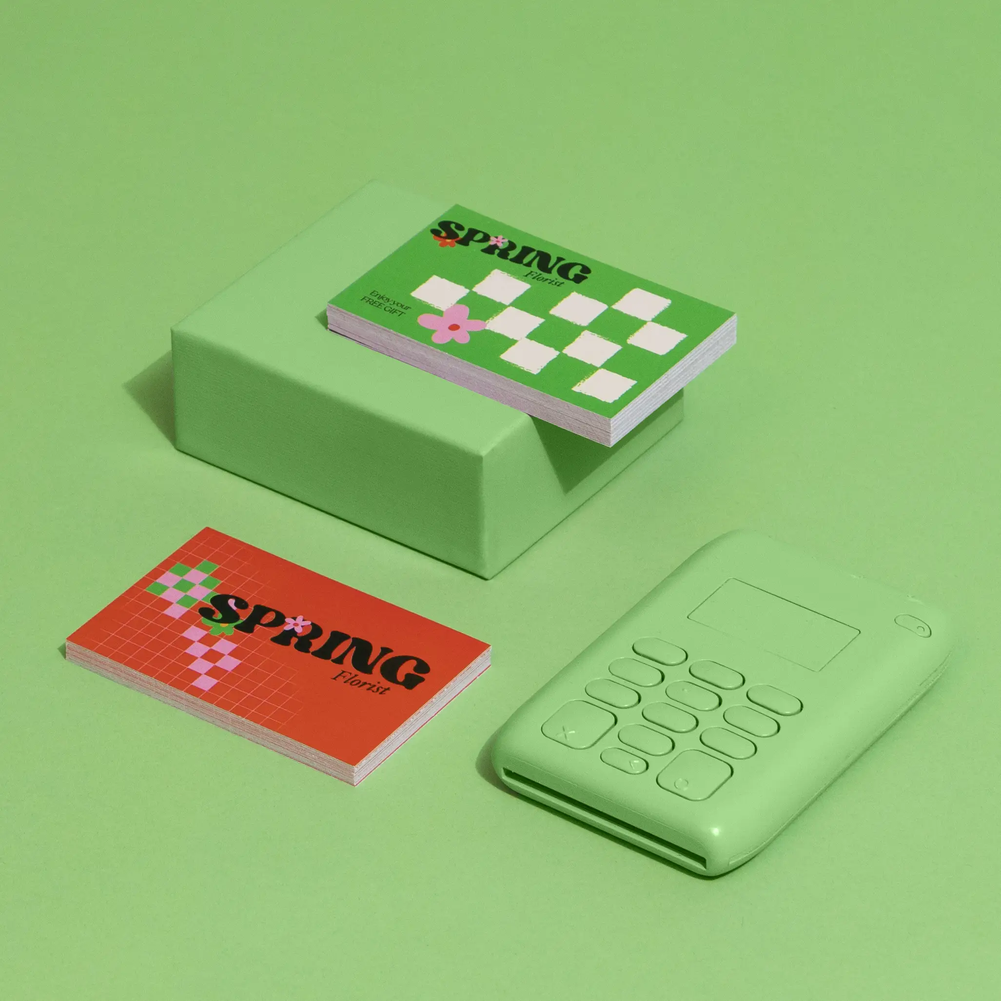 Retail loyalty cards in various colors fanned out on a counter