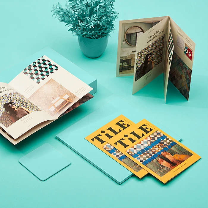 Range of saddle-stitched brochures displayed in different ways to show open and closed